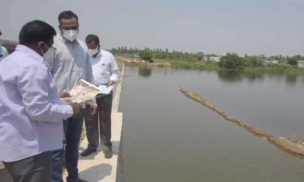 District Collector RV Karnan inspecting check dam construction works in Khammam on Sunday