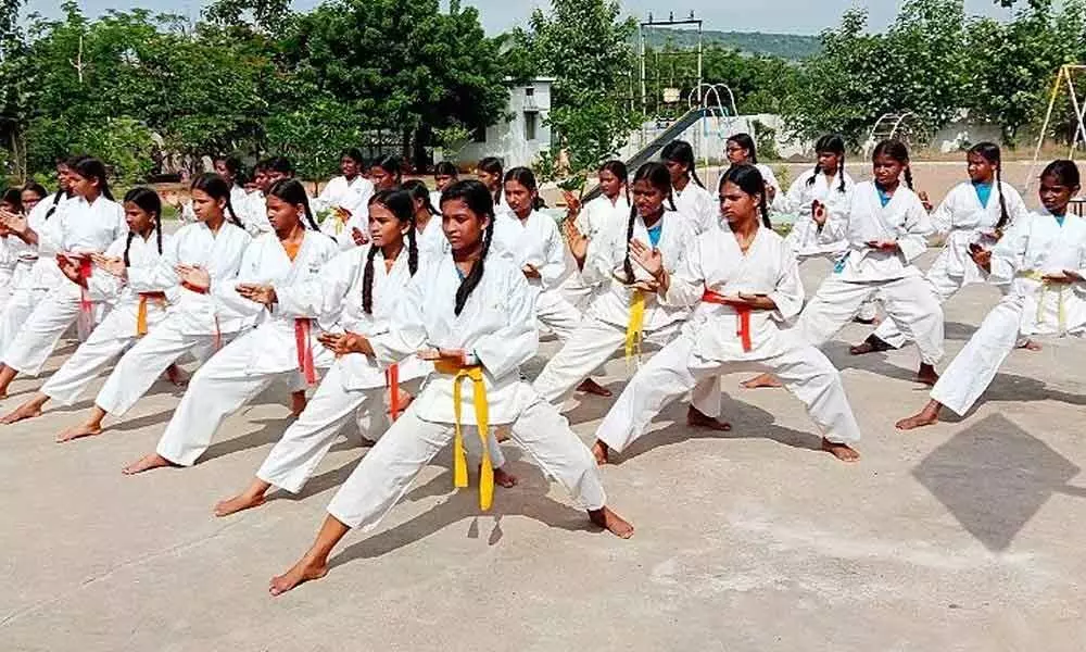 A Karate master training kids at a school in Karimnagar