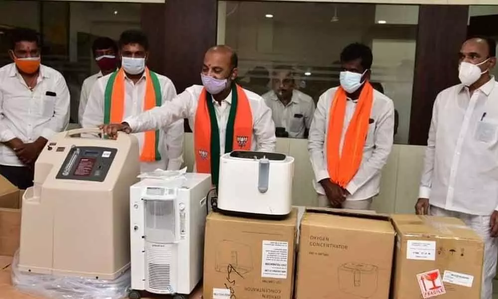 BJP State president and MP Bandi Sanjay Kumar distributing oxygen concentrates at the Karimnagar Parliamentary office