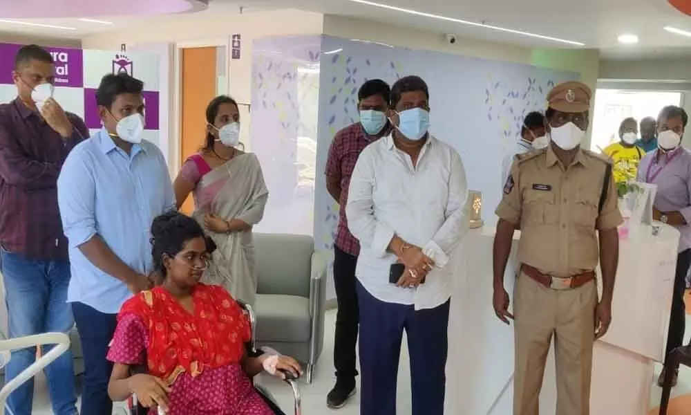Sandhya, the wife of constable Sujay Kumar, with task force staff at hospital  in Tirupati