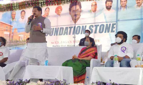 Deputy Speaker Kona Raghupati addressing a meeting held on the occasion of setting up of foundation stone for the medical college in Bapatla on Monday. Home Minister Mekathoti Sucharitha, Bapatla MP N Suresh, MLC KS Lakshmana Rao also seen