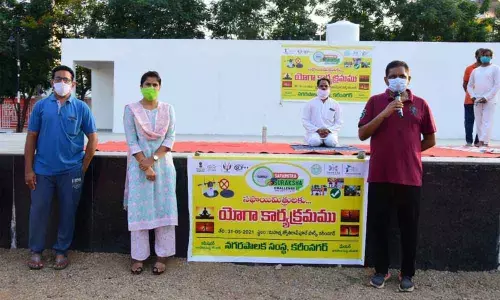 City Mayor Y Sunil Rao speaking at yoga programme for sanitation workers at Jyothirao Phule Park in Karimnagar on Monday