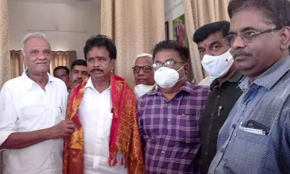 CPI leader K Narayana felicitating Anandaiah at his residence in Krishnapatnam  on Wednesday