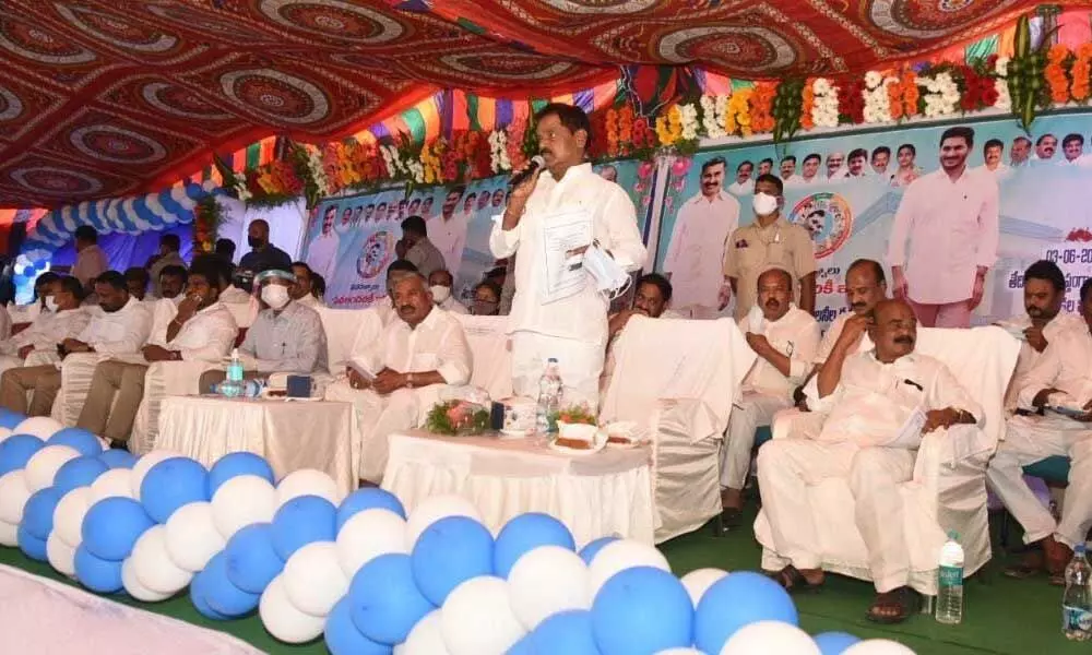 Deputy Chief Minister K Narayanaswamy addressing the gathering after launching of f Jagananna Housing Colony works in Punganur on Thursday. Panchayat Raj Minister Peddireddi Ramachandra Reddy is also seen.