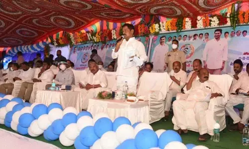 Deputy Chief Minister K Narayanaswamy addressing the gathering after launching of f Jagananna Housing Colony works in Punganur on Thursday. Panchayat Raj Minister Peddireddi Ramachandra Reddy is also seen.