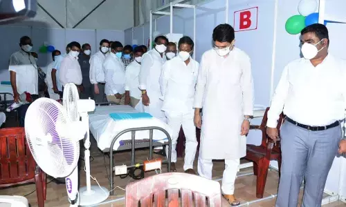 Minister for Finance and Labour Buggana Rajendranath Reddy and Gummanur Jayaram observing facilities in German shed in Kurnool on Thursday. Collector G Veera Pandiyan is also seen.