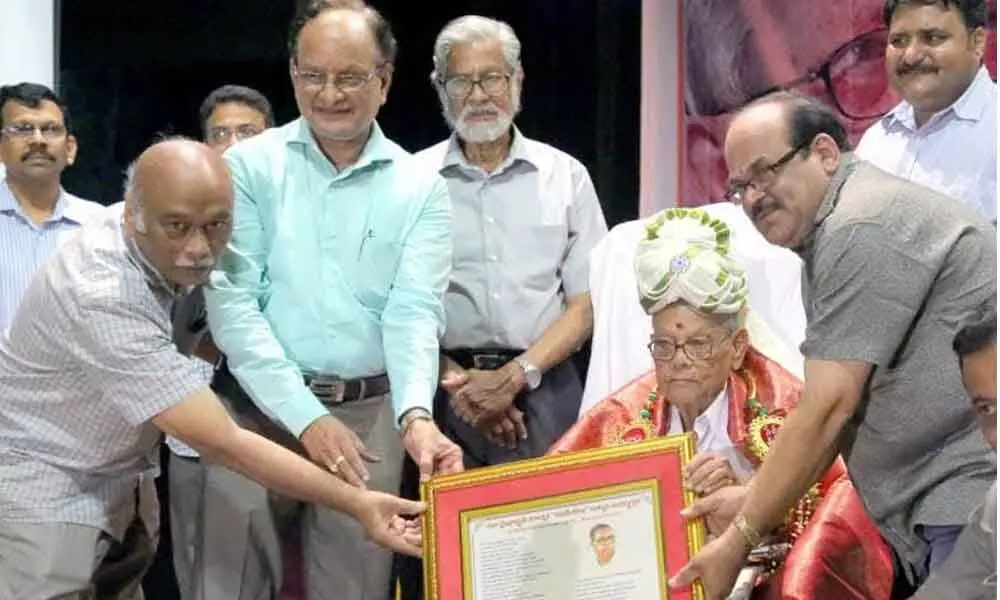 File photo of Kalipatnam Ramarao felicitated by the alumni of St Anthonys High School on the occasion of his 90th birthday celebrated in Visakhapatnam.