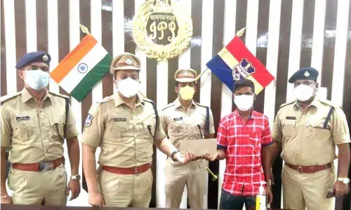 Maoist Madakam Nandal alias Nandu surrendering before Superintendent of Police Sangram Singh G Patil in Mulugu on Friday