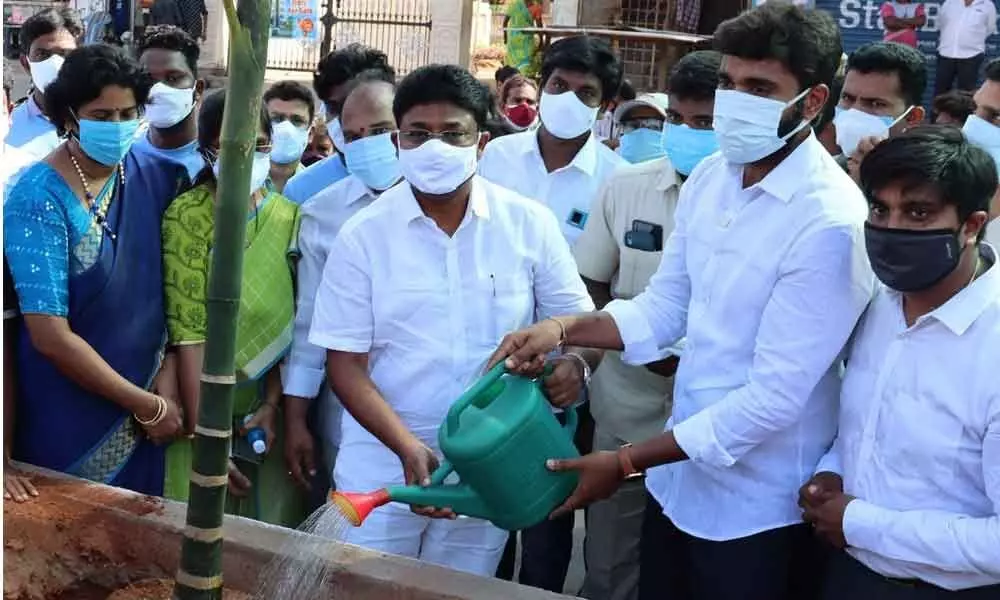 Education Minister A Suresh along with MP M Bharat Ram plants a tree on the occasion of World Environment Day in Rajamahendravaram on Saturday