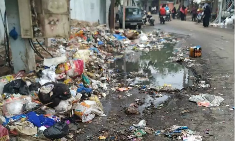 Pre-monsoon rain spreads garbage on roads in Old City