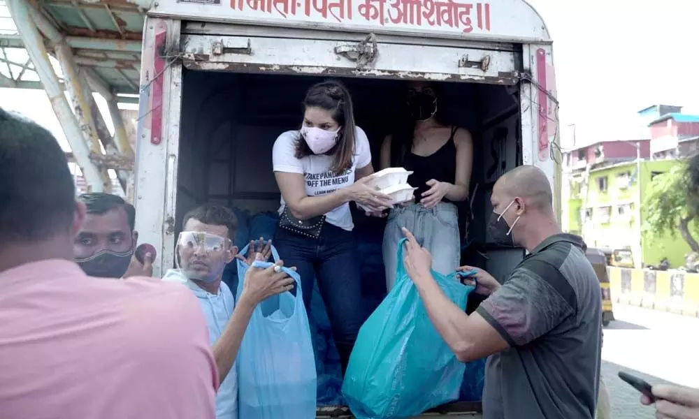 World Environment Day: Sunny Leone, Daniel Weber and influencer Amy Aela distributes vegan meals in Mumbai
