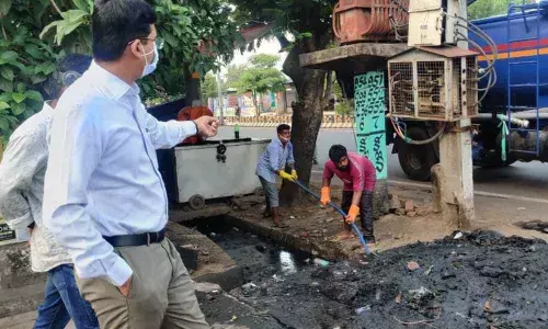 KMC Commissioner Swapnil Dinakar Pundkar inspecting silt removal process through a jetting machine in Kakinada  on Monday