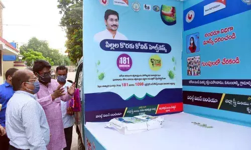 Krishna district Collector Md Imtiaz flagging off Covid campaign vehicles in Vijayawada on Monday