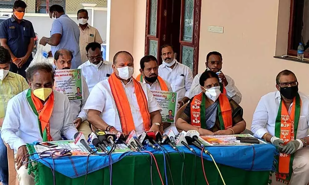 BJP State former president Kanna Lakshminarayana addressing the media at his residence in Guntur on Tuesday. BJP State vice-president Ravela Kishore Babu, former minister Dr Sanakkayala Aruna also seen.