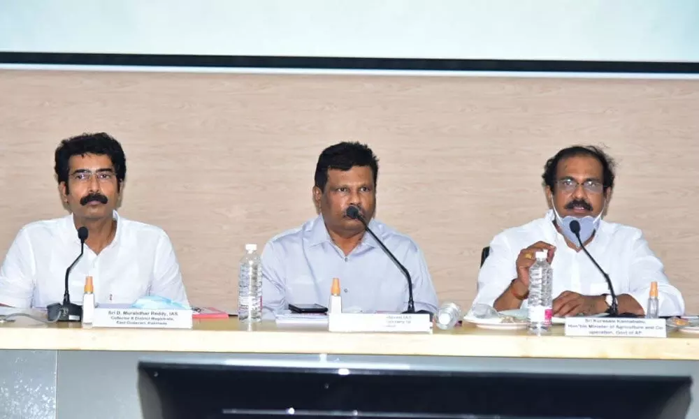 Minister K Kannababu, Special Chief Secretary to Industries and Commerce R Karikal Valaveen and Collector Muralidhar Reddy addressing officials in Kakinada on Tuesday