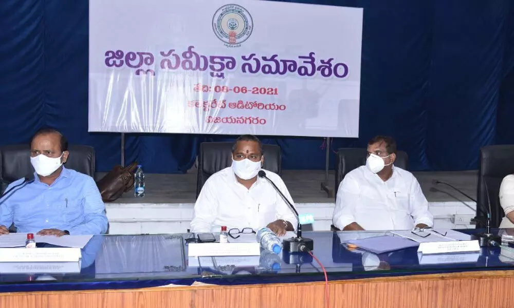 In-charge Minister Vellampalli Srinivas addressing the District Review Committee meeting in Vizianagaram on Tuesday