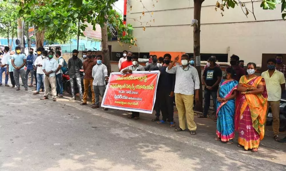 APSRTC outsourced employees protesting at Tourism Minister M Srinivasa Rao’s camp office in Visakhapatnam on Tuesday