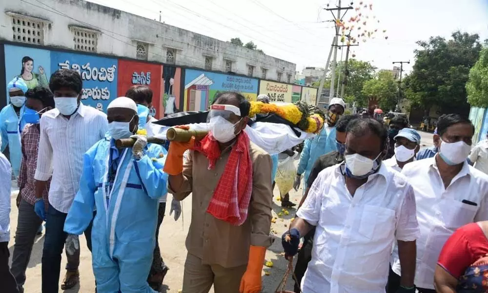 Tirupati MLA Bhumana Karunakar Reddy takes part in the funeral of a Covid-19 patient in Tirupati on May 13