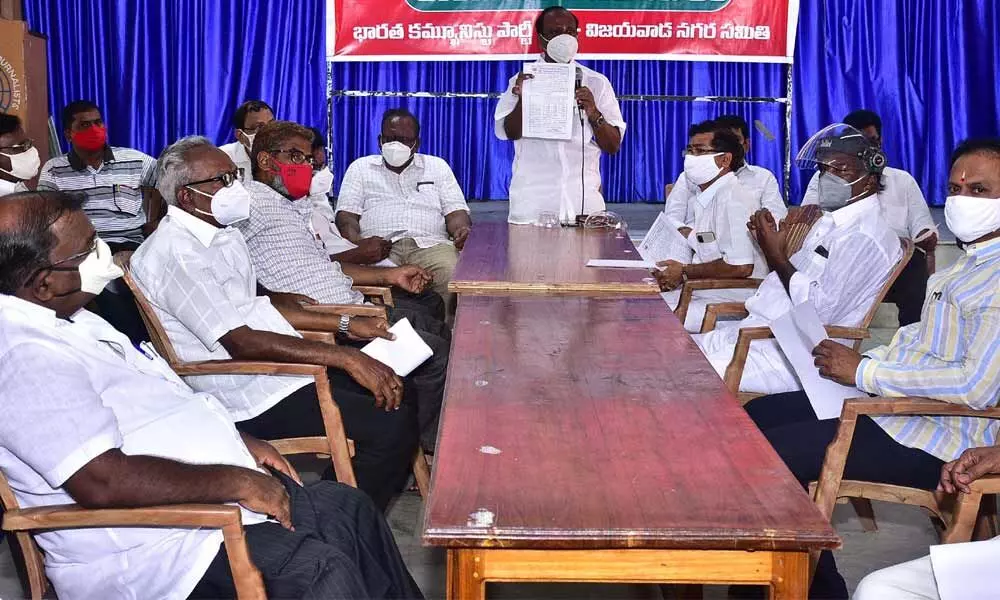 CPI leaders holding a roundtable at Vijayawada Press Club on Wednesday