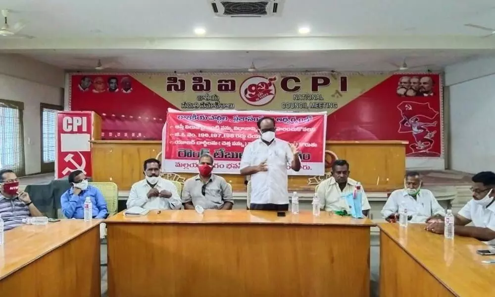 CPI district secretary J Ajay Kumar addressing a roundtable in Guntur on Wednesday
