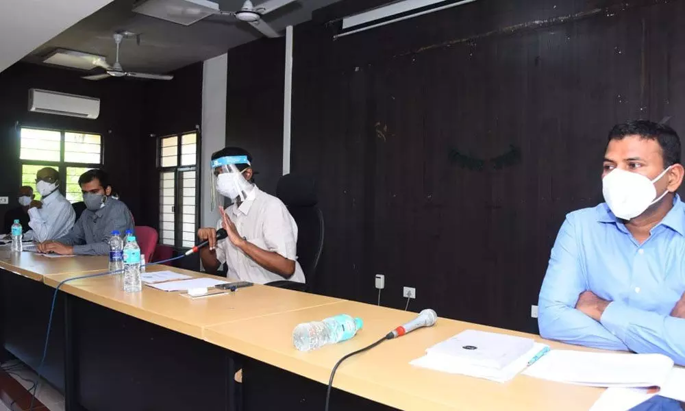 Collector M Hari Narayanan reviewing with doctors and officials on Covid third wave in Chittoor on Wednesday. Joint Collector V Veerabrahmam is also seen.
