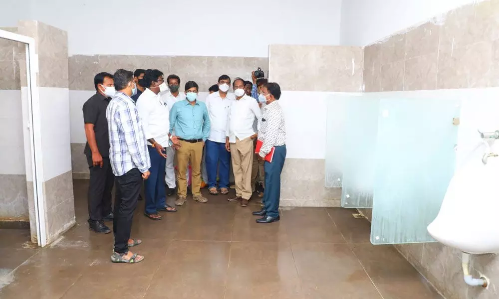 Transport Minister P Ajay Kumar checking toilets in the new bus stand in Khammam on Thursday