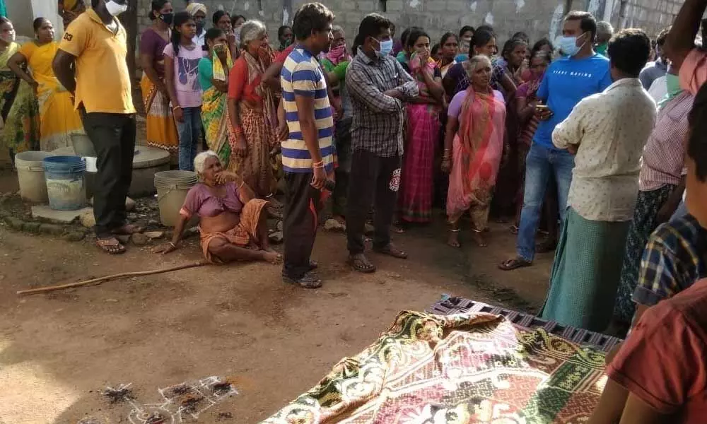 People gathered near Chimala Satish’s residence in Upparapalli village, Warangal Rural district