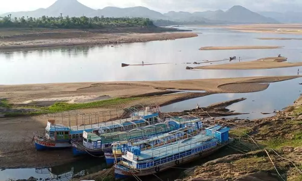 Boats and launches anchored at River Godavari and Sabari confluence at Kunavaram mandal of East Godavari district