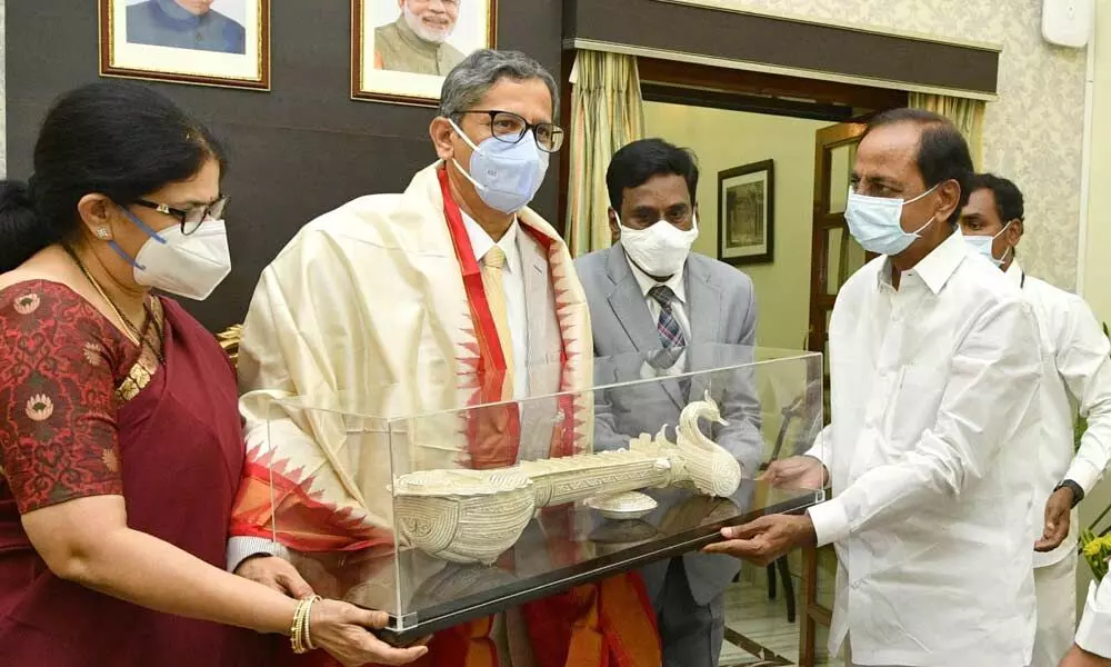 Chief Justice of India Justice NV Ramana being greeted by Chief Minister K Chandrashekar Rao at Raj Bhavan in Hyderabad on Friday