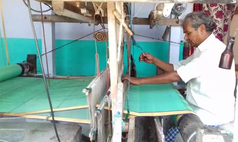 A weaver on the handloom at Eepurupalem in Chirala mandal in Prakasam district
