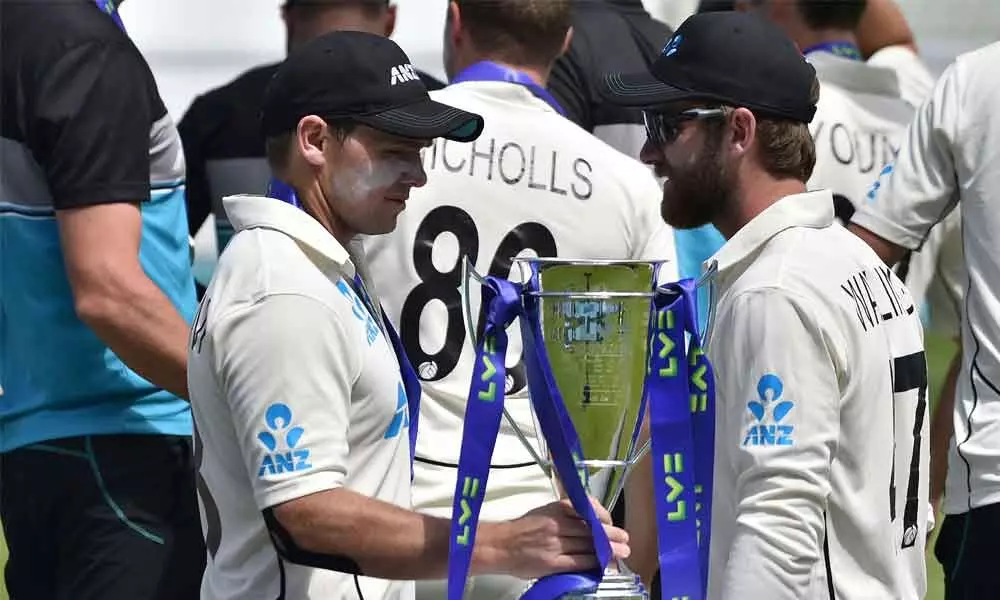 New Zealands Tom Latham (left) holds the winners trophy as he stands with teammate Kane Williamson after their win in the second Test match against England at Edgbaston in Birmingham, England on Sunday