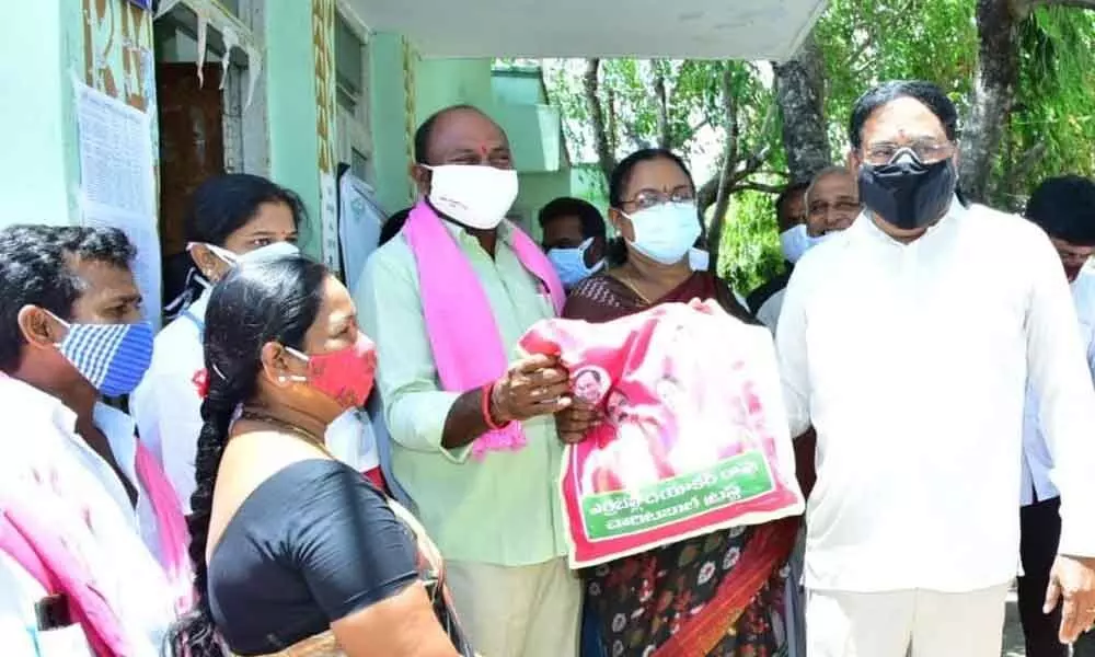 Minister for Panchayat Raj Errabelli Dayakar Rao distributing essentials to poor (File photo)