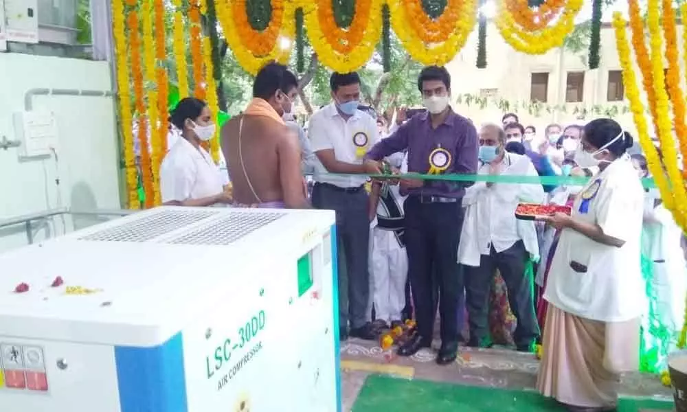 District Collector D Anudeep and SCCL Director N Balaram launching oxygen generator plant at the company’s main hospital in Kothagudem on Monday