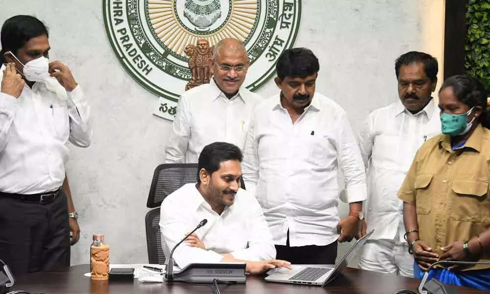 Chief Minister Y S Jagan Mohan Reddy transfers Vahana Mitra amounts into the accounts of beneficiaries from his camp office in Tadepalli on Tuesday