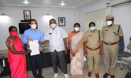 Collector Pravin Kumar, Giddalur MLA Anna Rambabu and DTC Krishnaveni presenting the sanction certificate to a beneficiary under YSR Vahana Mitra in Ongole on Tuesday