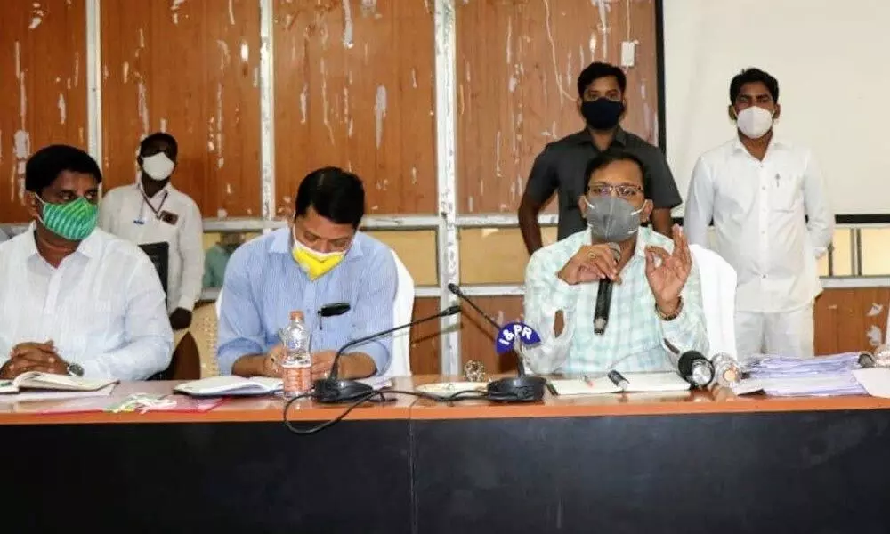 District Collector along with other officers speaking in a meeting at district Collectorate on Wednesday