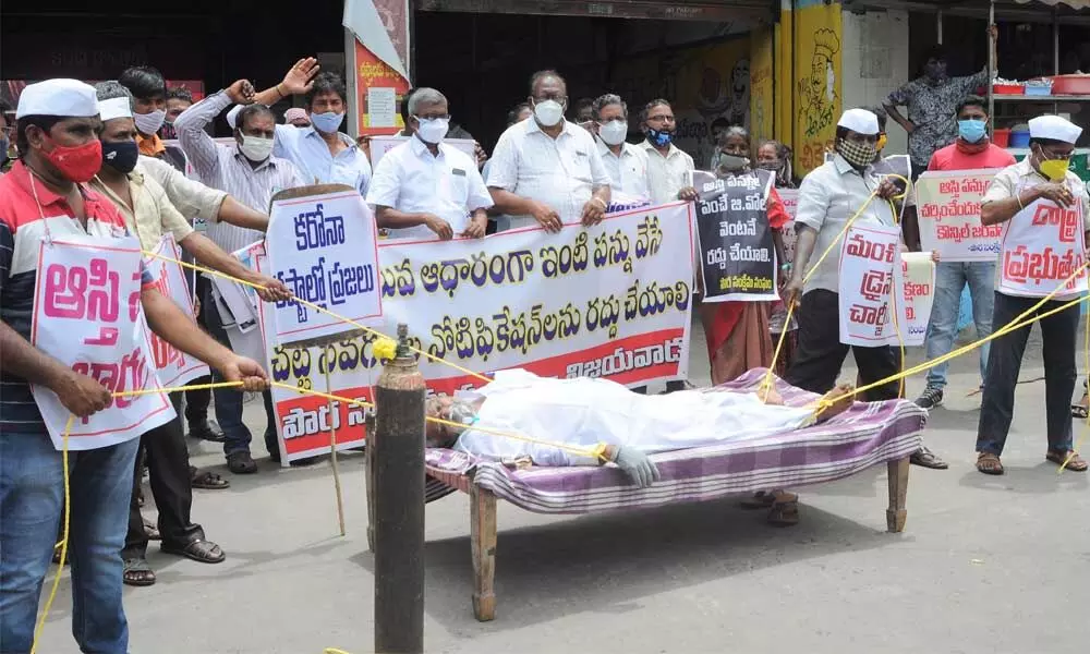 AP Urban Citizens Forum staging a novel demonstration in Vijayawada on Wednesday
