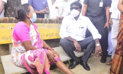 Minister Ajay Kumar interacting with Panchayat sanitary worker in Manchukonda villager on Wednesday.