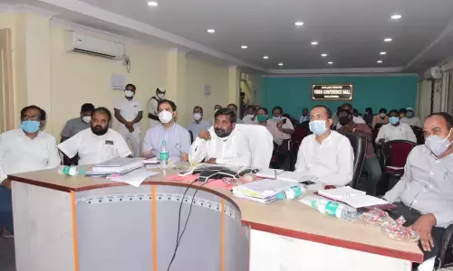 Minister Jagadish Reddy interacting with other officials through video conference in Nalgonda on Wednesday.