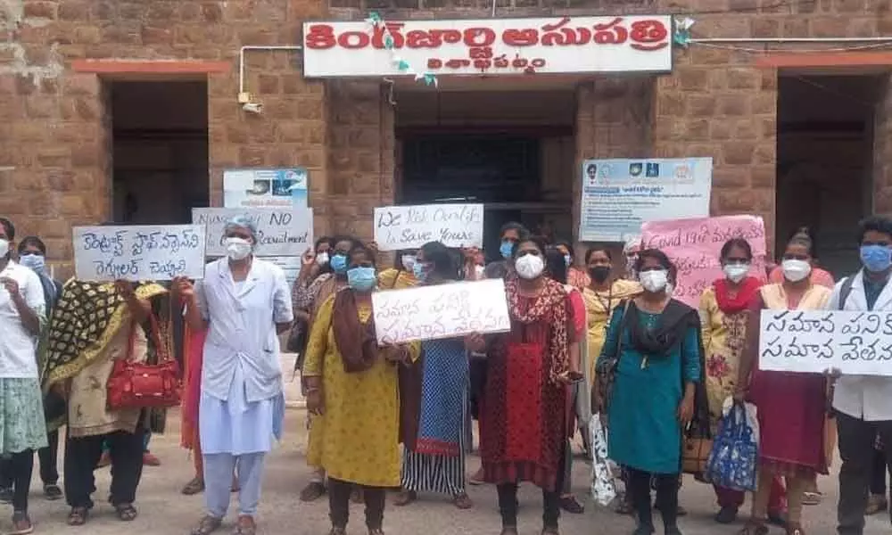 Contract staff nurses staging a protest at KGH in Visakhapatnam on Friday