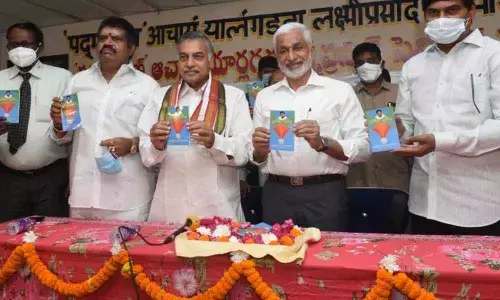 Minister M Srinivasa Rao, Official Language Commission chairman Yarlagadda Lakshmi Prasad, MP V Vijayasai Reddy