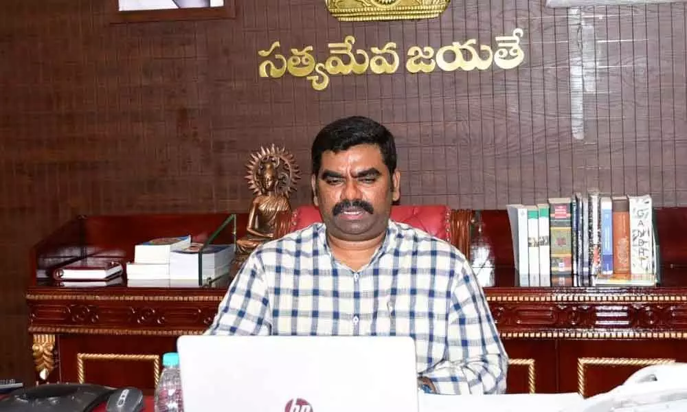 District Collector G Veera Pandian conducting tele-conference on mega vaccination drive from his camp office in Kurnool on Saturday