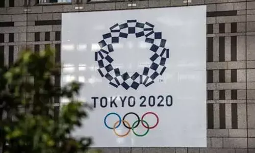 Olympics organisers may further reduce overseas delegates by 25,000