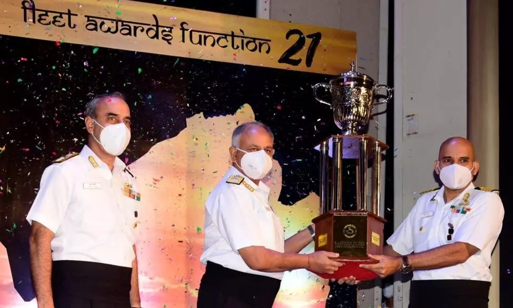 Commanding Officer INS Sahyadri, Captain CP Sanga, receiving the Best Ship Trophy from Flag Officer, Commanding in Chief, ENC Vice-Admiral AB Singh