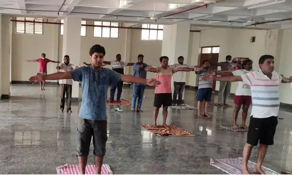 Covid patients practicing yoga at Sri Padmavathi Nilayam Covid care centre in Tirupati