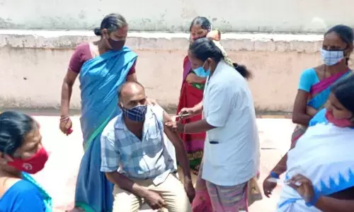 Vaccination drive being conducted at Kothapeta Rythu Bazaar in Kurnool town on Sunday