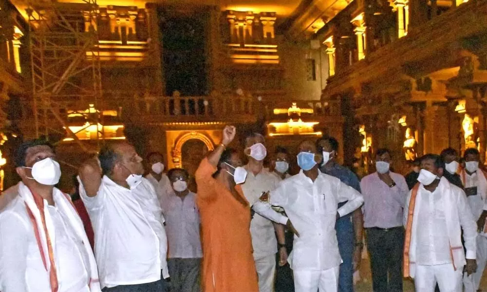 Chief Minister K Chandrasekhar Rao along with officials taking  a look at the glowing Yadadri temple on Monday.