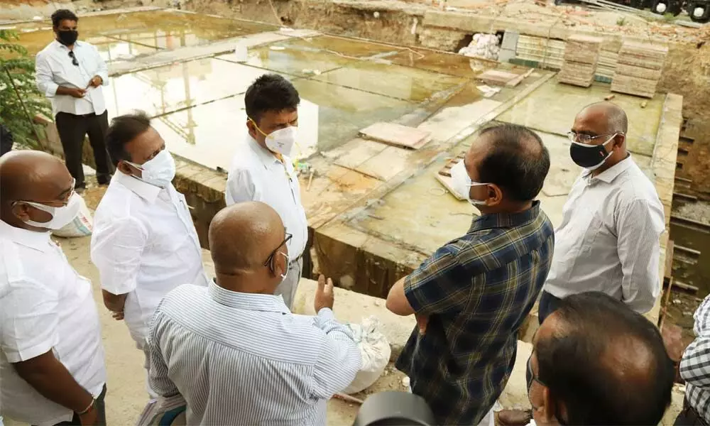 MLA Bhumana Karunakar Reddy, Municipal Commissioner P S Girisha and other officials inspecting the RUB works at Rayalacheruvu road in Tirupati on Tuesday