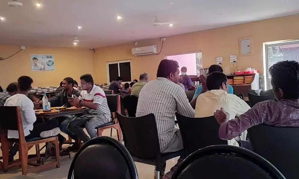 After a long time, people return to restaurants in Visakhapatnam as the curfew relaxation period gets extended from 6 am to 6 pm  	Photo: Vasu Potnuru