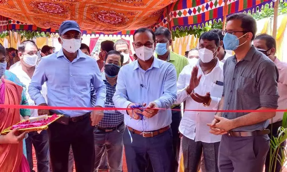 DRM of Waltair division Chetan Kumar Shrivastava launching parcel facility at Visakhapatnam railway station